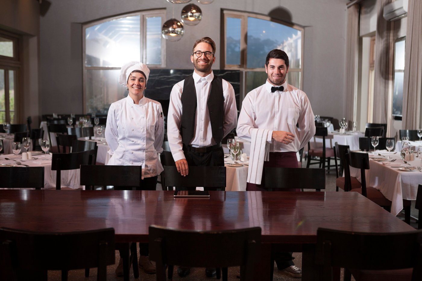 Restaurant employees receiving guests